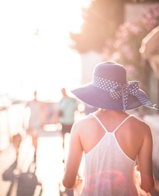 Beautiful Girl with Hat in Sun